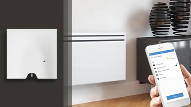 J’installe une sortie de câble connectée sur un radiateur électrique avec fil pilote